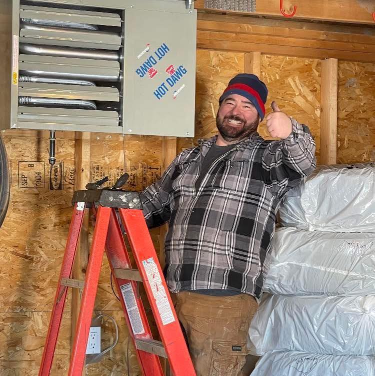 Jolly Jon Plumbing team member working on-site